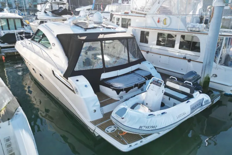  Yacht Photos Pics 2012 Sea Ray 470 Sundancer yacht docked with inflatable boat attached.