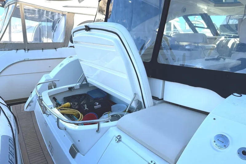  Yacht Photos Pics 2012 Sea Ray 470 Sundancer yacht with open storage compartment, showcasing interior equipment.