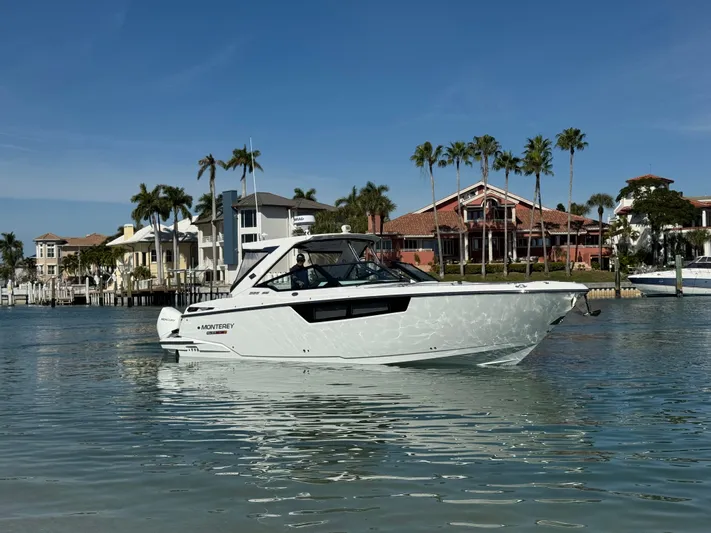 Inception Yacht Photos Pics 2023 Monterey 385 SS boat near coastal homes.