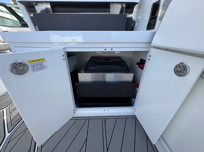 Inception Yacht Photos Pics Open storage compartment on a 2023 Monterey 385 SS boat.