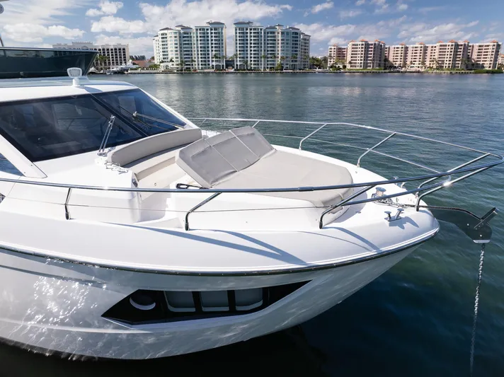 Holy Moly Yacht Photos Pics 2020 Absolute 50 Fly yacht on water with cityscape background.