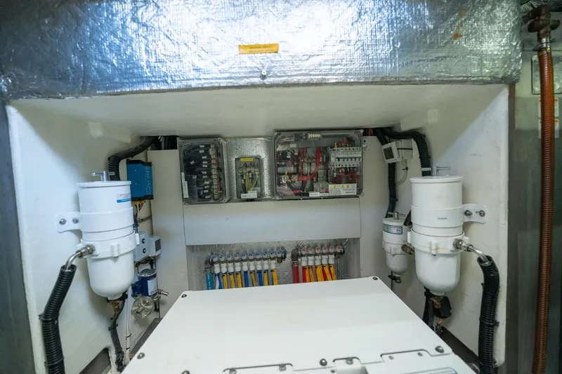 Holy Moly Yacht Photos Pics Engine room of 2020 Absolute 50 Fly yacht, showcasing electrical systems and components.