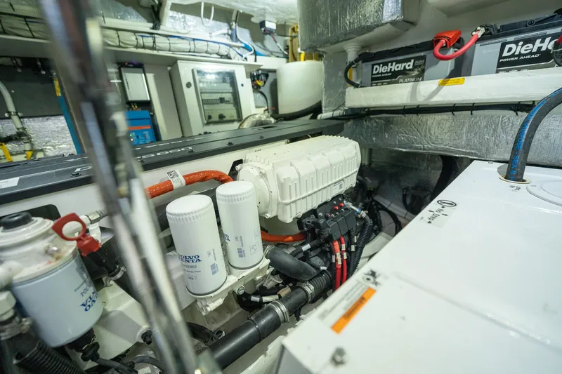 Holy Moly Yacht Photos Pics Engine room of 2020 Absolute 50 Fly yacht, featuring DieHard batteries and filtration system.