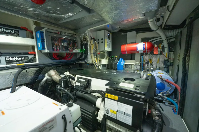 Holy Moly Yacht Photos Pics Engine room of 2020 Absolute 50 Fly yacht, featuring advanced equipment and wiring.