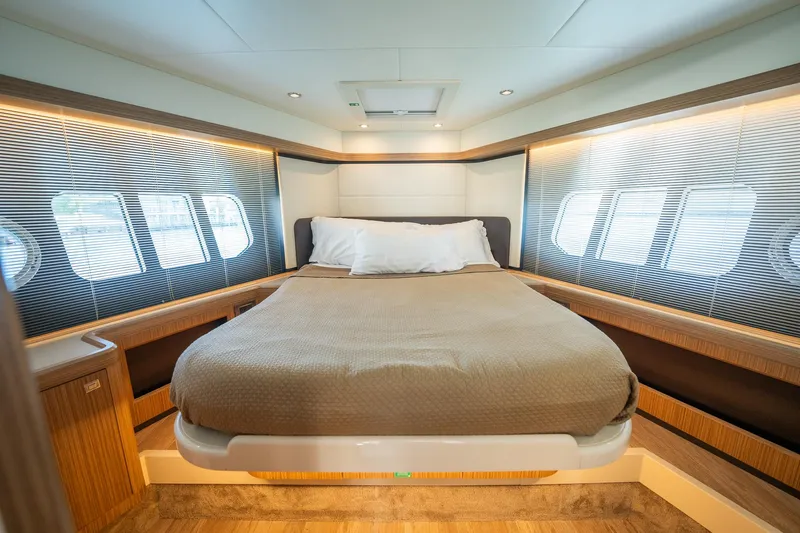 Holy Moly Yacht Photos Pics Luxurious bedroom interior of 2020 Absolute 50 Fly yacht with modern design and cozy bedding.
