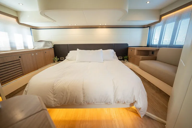 Holy Moly Yacht Photos Pics Luxurious bedroom interior of 2020 Absolute 50 Fly yacht with modern design and cozy ambiance.