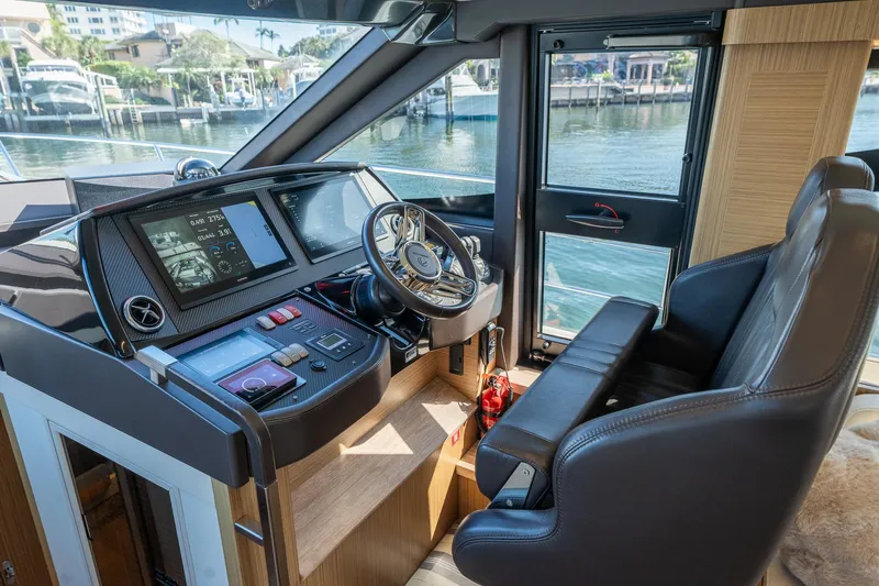 Holy Moly Yacht Photos Pics Luxurious helm of 2020 Absolute 50 Fly yacht with modern navigation equipment.