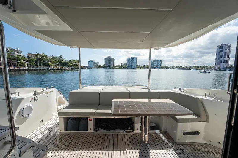 Holy Moly Yacht Photos Pics Luxury Absolute 50 Fly yacht deck with seating, overlooking waterfront skyline, 2020 model.
