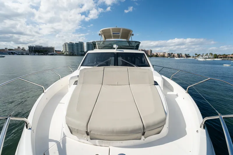 Holy Moly Yacht Photos Pics 2020 Absolute 50 Fly yacht on water, featuring spacious deck and modern design.