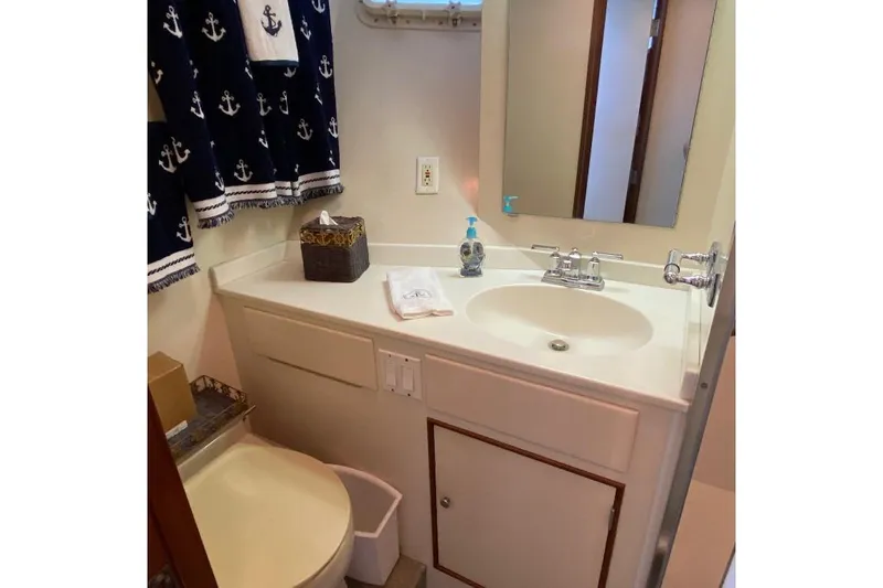  Yacht Photos Pics Bathroom interior of 1988 Burger 80 Motor Yacht with nautical-themed decor.
