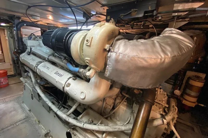  Yacht Photos Pics Engine room of 1988 Burger 80 Motor Yacht showcasing a powerful diesel engine.