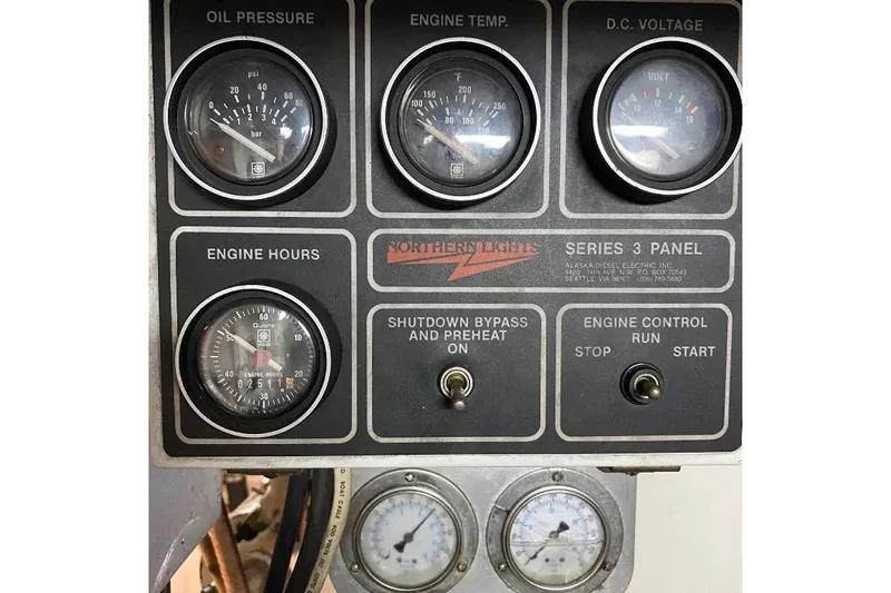  Yacht Photos Pics Control panel of a 1988 Burger 80 Motor Yacht with gauges and switches.