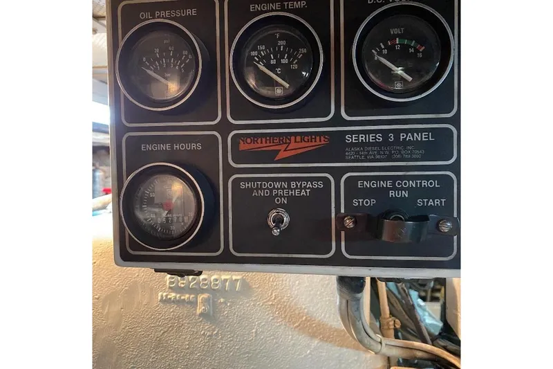  Yacht Photos Pics Control panel of a 1988 Burger 80 Motor Yacht, featuring gauges and engine controls.