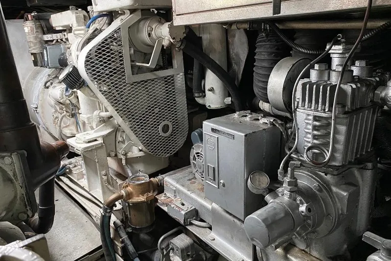  Yacht Photos Pics Engine room of a 1988 Burger 80 Motor Yacht, showcasing mechanical components and machinery.