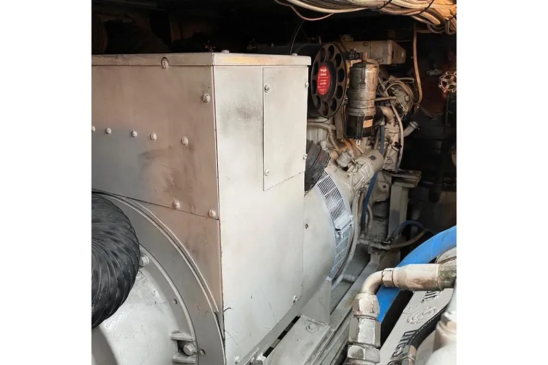  Yacht Photos Pics Engine room of 1988 Burger 80 Motor Yacht, showcasing mechanical components and wiring.