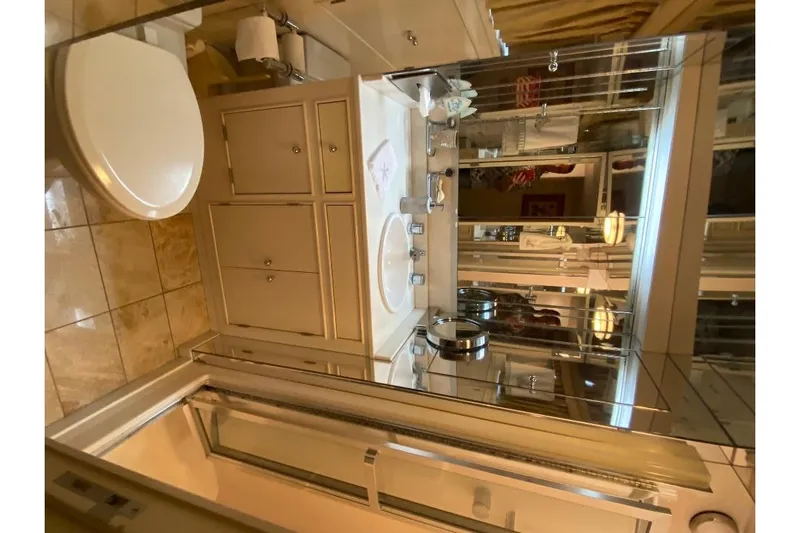  Yacht Photos Pics Luxurious bathroom on a 1988 Burger 80 Motor Yacht.