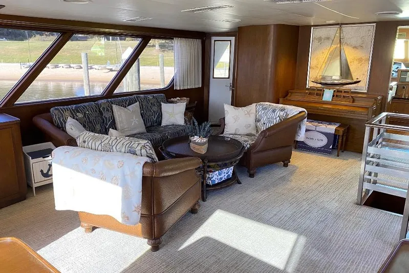  Yacht Photos Pics Luxurious interior of 1988 Burger 80 Motor Yacht with elegant seating and nautical decor.