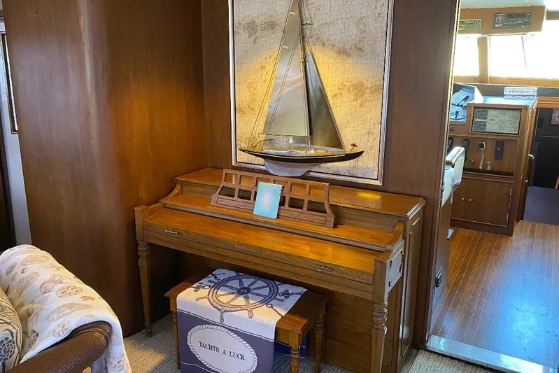  Yacht Photos Pics Luxurious 1988 Burger 80 Motor Yacht interior with piano and nautical decor.