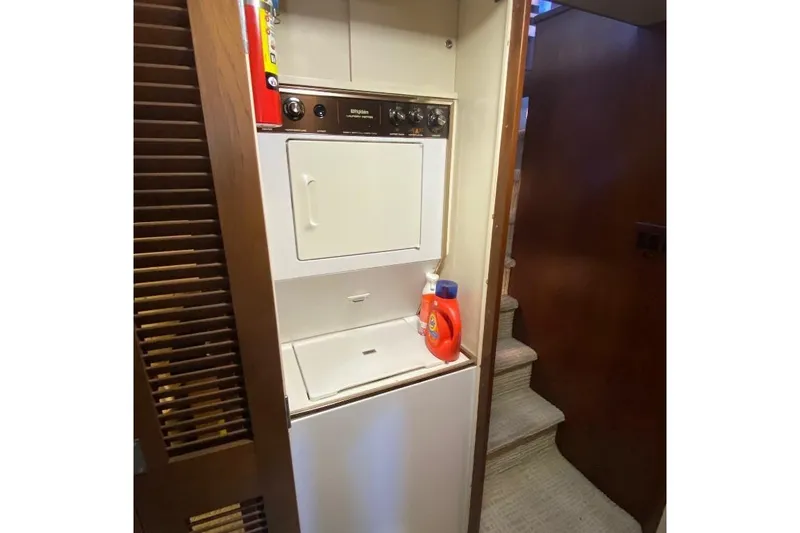  Yacht Photos Pics Laundry area on 1988 Burger 80 Motor Yacht with washer, dryer, and detergent.
