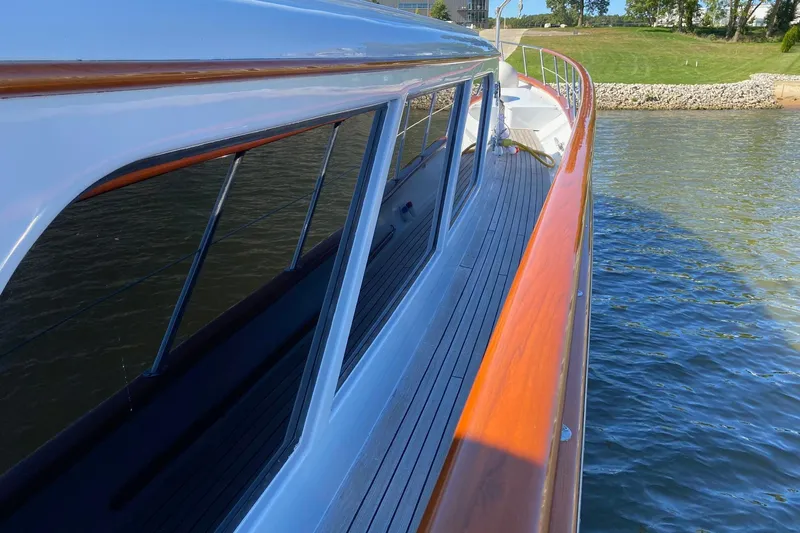  Yacht Photos Pics 1988 Burger 80 Motor Yacht with sleek design, docked by the water.