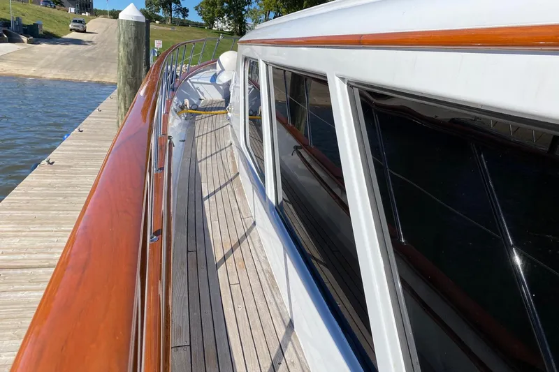  Yacht Photos Pics 1988 Burger 80 Motor Yacht docked, showcasing polished wood and sleek design.