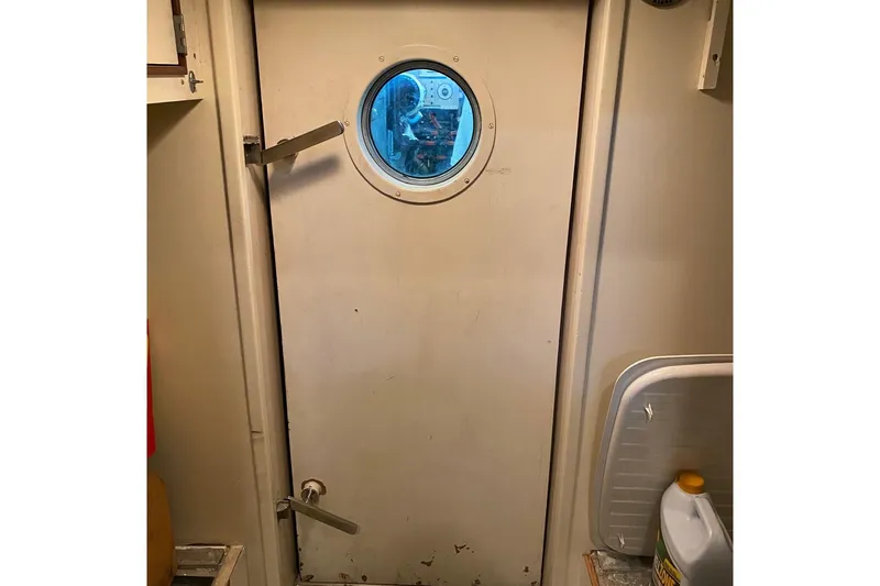  Yacht Photos Pics Engine room door with porthole on 1988 Burger 80 Motor Yacht.
