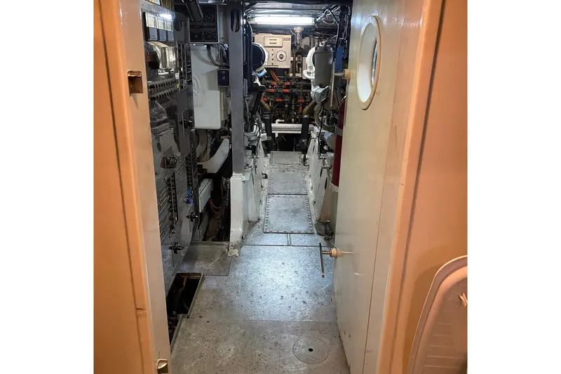  Yacht Photos Pics Engine room of 1988 Burger 80 Motor Yacht, showcasing mechanical equipment and controls.