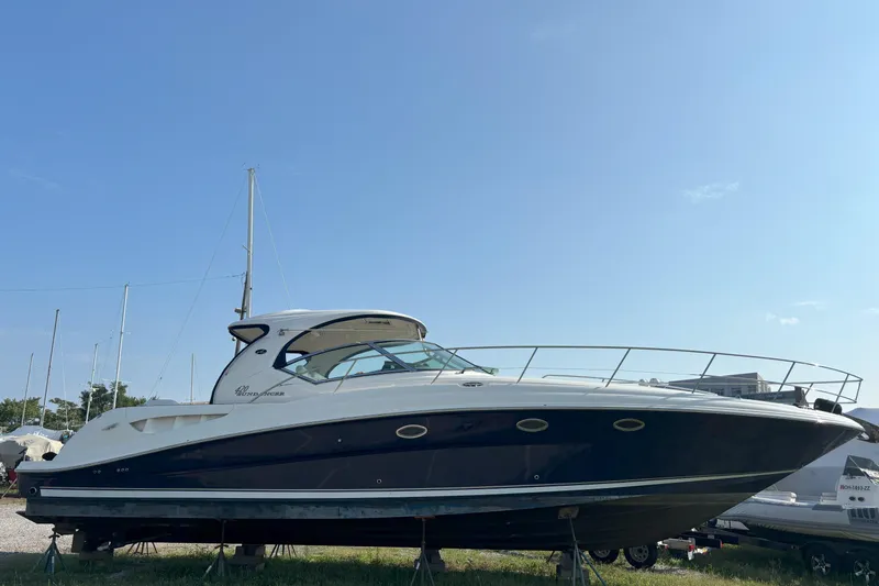  Yacht Photos Pics 2005 Sea Ray 420 Sundancer yacht on land under clear blue sky.