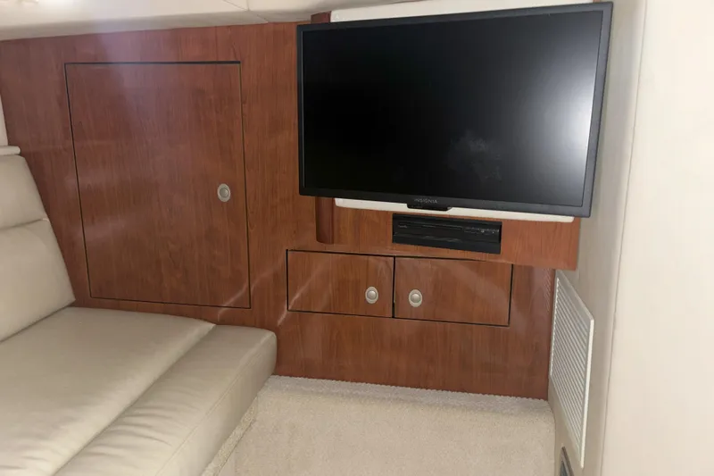  Yacht Photos Pics Interior of 2005 Sea Ray 420 Sundancer with TV and wooden cabinetry.