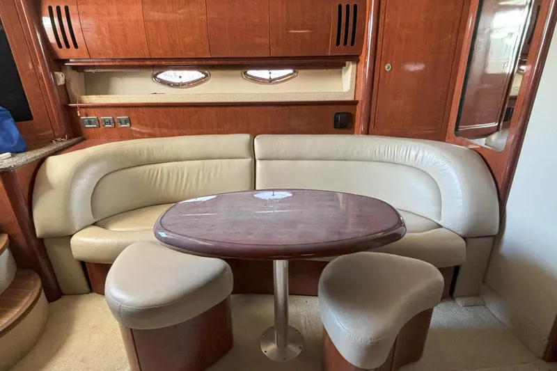  Yacht Photos Pics Luxurious 2005 Sea Ray 420 Sundancer yacht interior with elegant seating and wooden table.