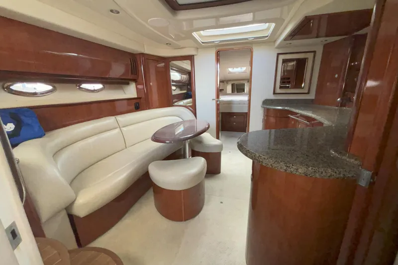  Yacht Photos Pics Luxurious interior of 2005 Sea Ray 420 Sundancer yacht with elegant seating and modern amenities.