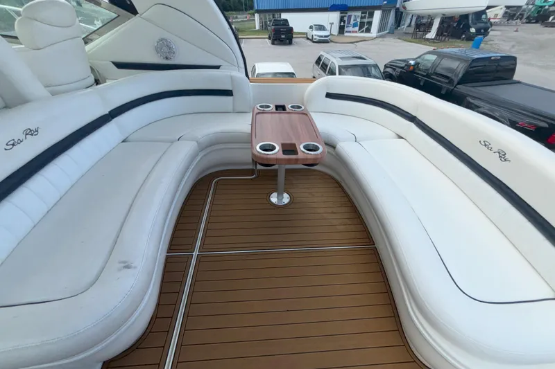  Yacht Photos Pics Luxurious seating area on 2005 Sea Ray 420 Sundancer yacht with wooden table.