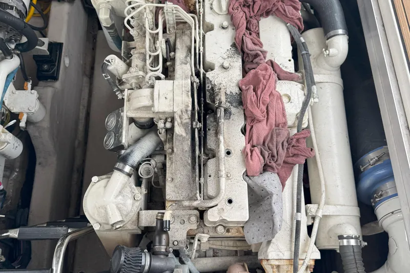  Yacht Photos Pics Engine compartment of a 2005 Sea Ray 420 Sundancer with visible components and hoses.