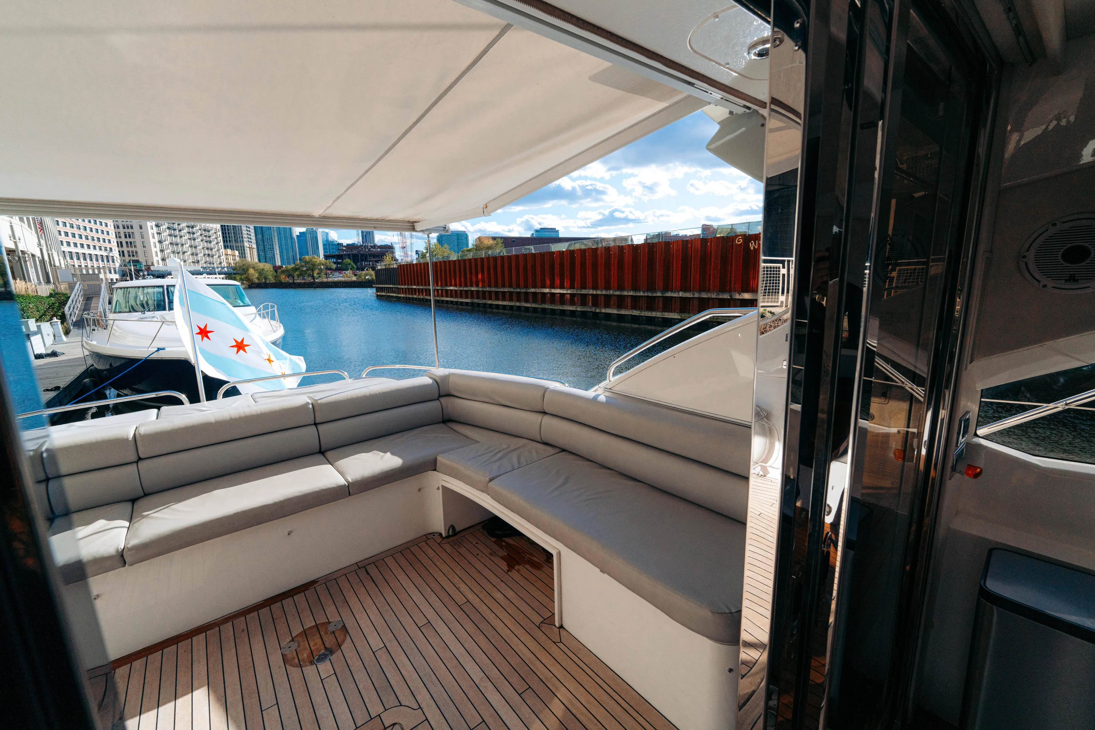  Yacht Photos Pics Luxury Sunseeker Predator 60 yacht interior, 2014 model, docked with cityscape view.