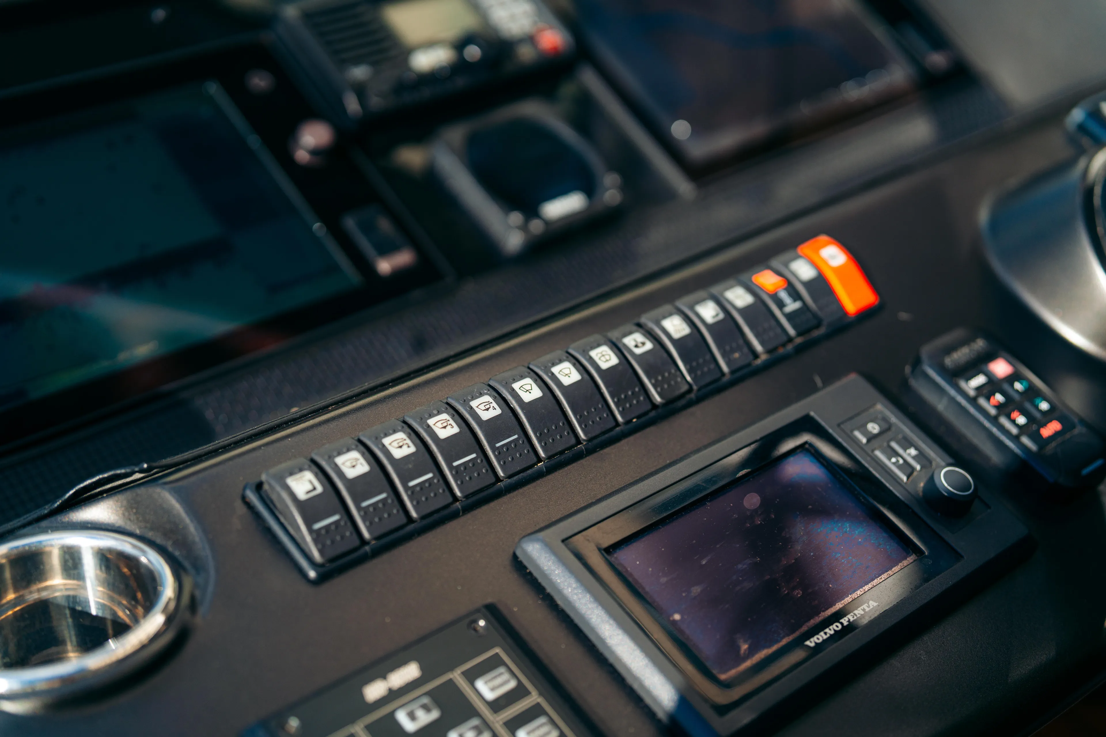  Yacht Photos Pics Control panel of a 2014 Sunseeker Predator 60 yacht, featuring various switches and displays.