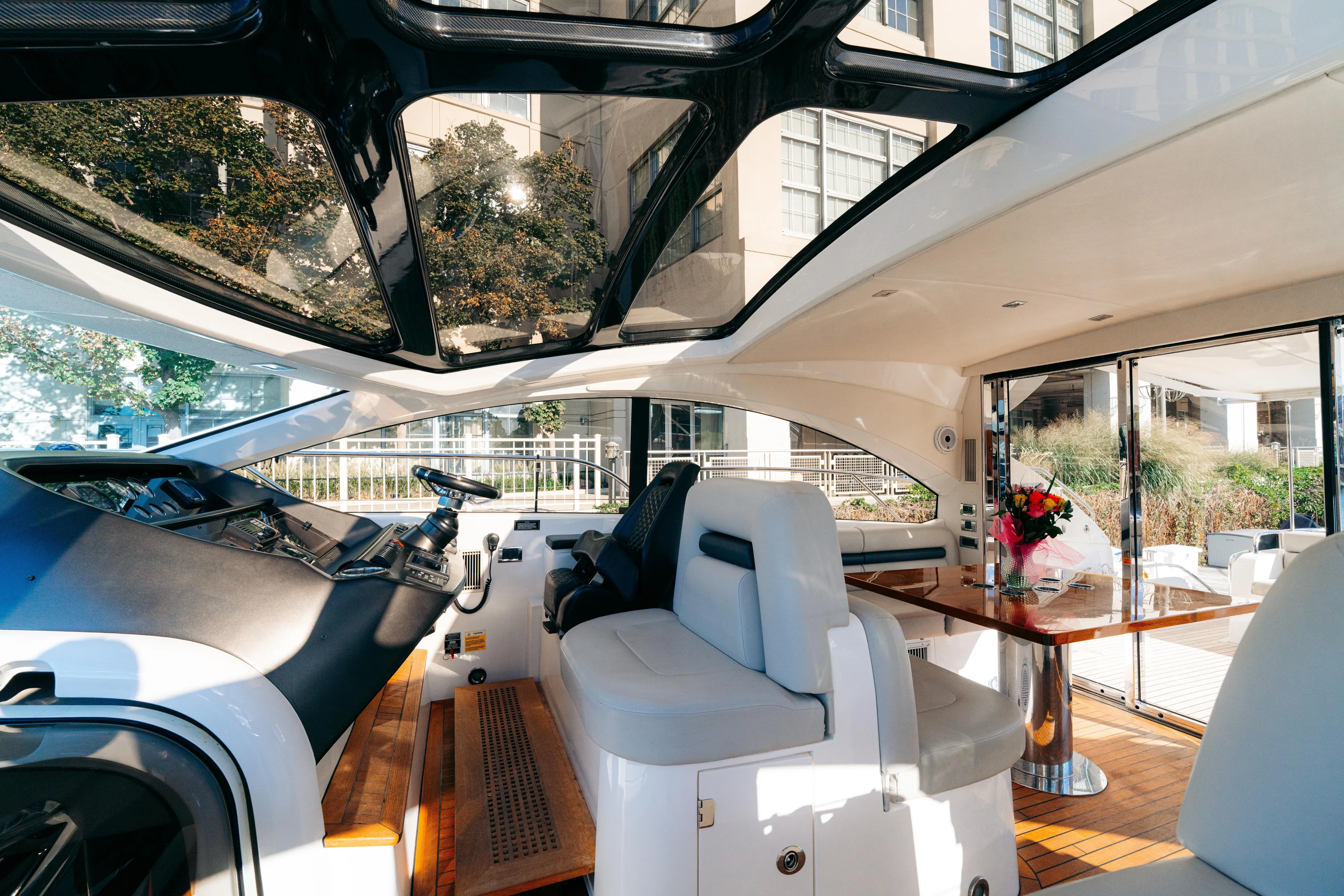  Yacht Photos Pics Luxurious interior of 2014 Sunseeker Predator 60 yacht with modern seating and elegant table.
