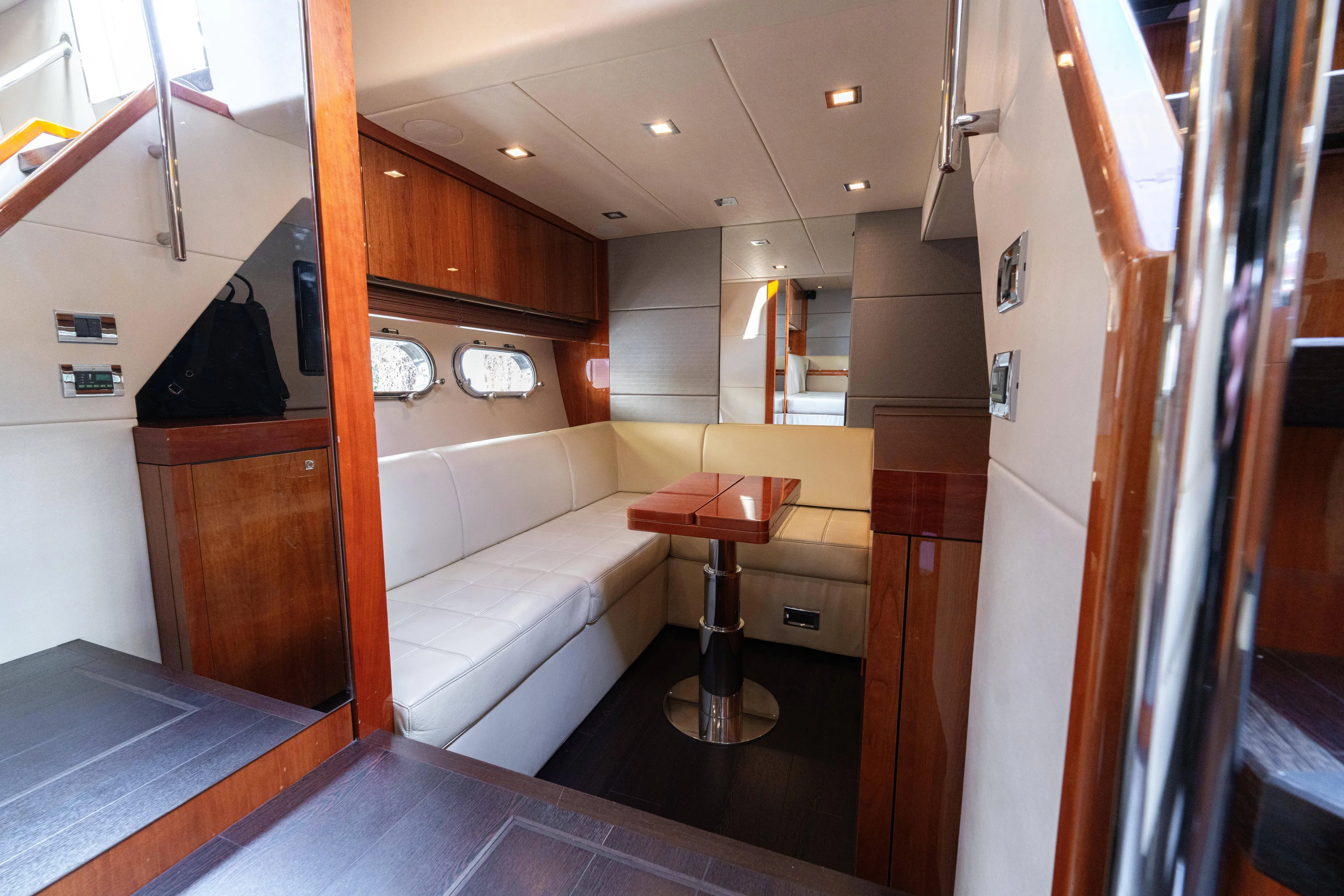  Yacht Photos Pics Luxurious interior of 2014 Sunseeker Predator 60 yacht with elegant seating and wooden finishes.