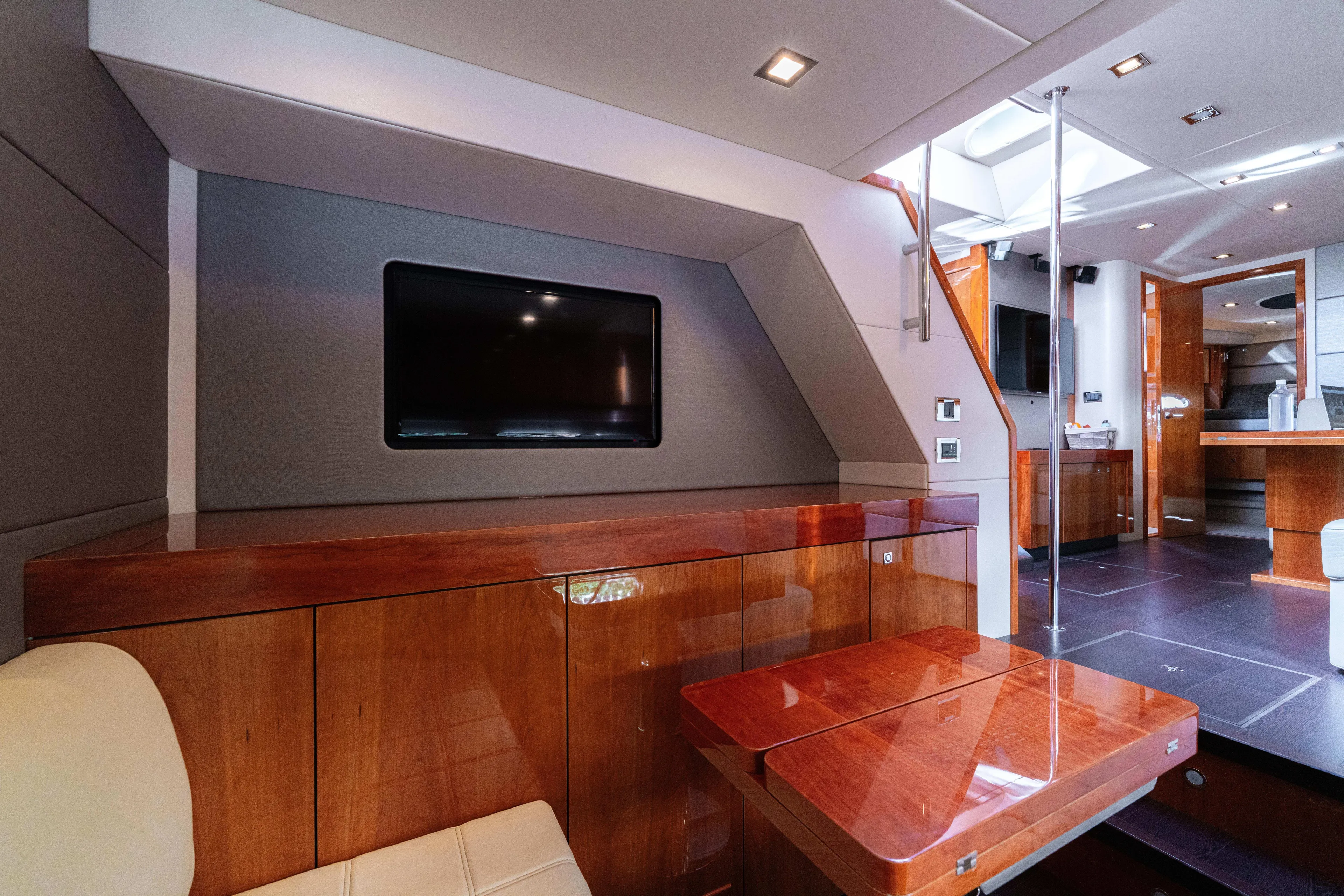  Yacht Photos Pics Luxurious interior of 2014 Sunseeker Predator 60 yacht with sleek wood finishes and modern amenities.