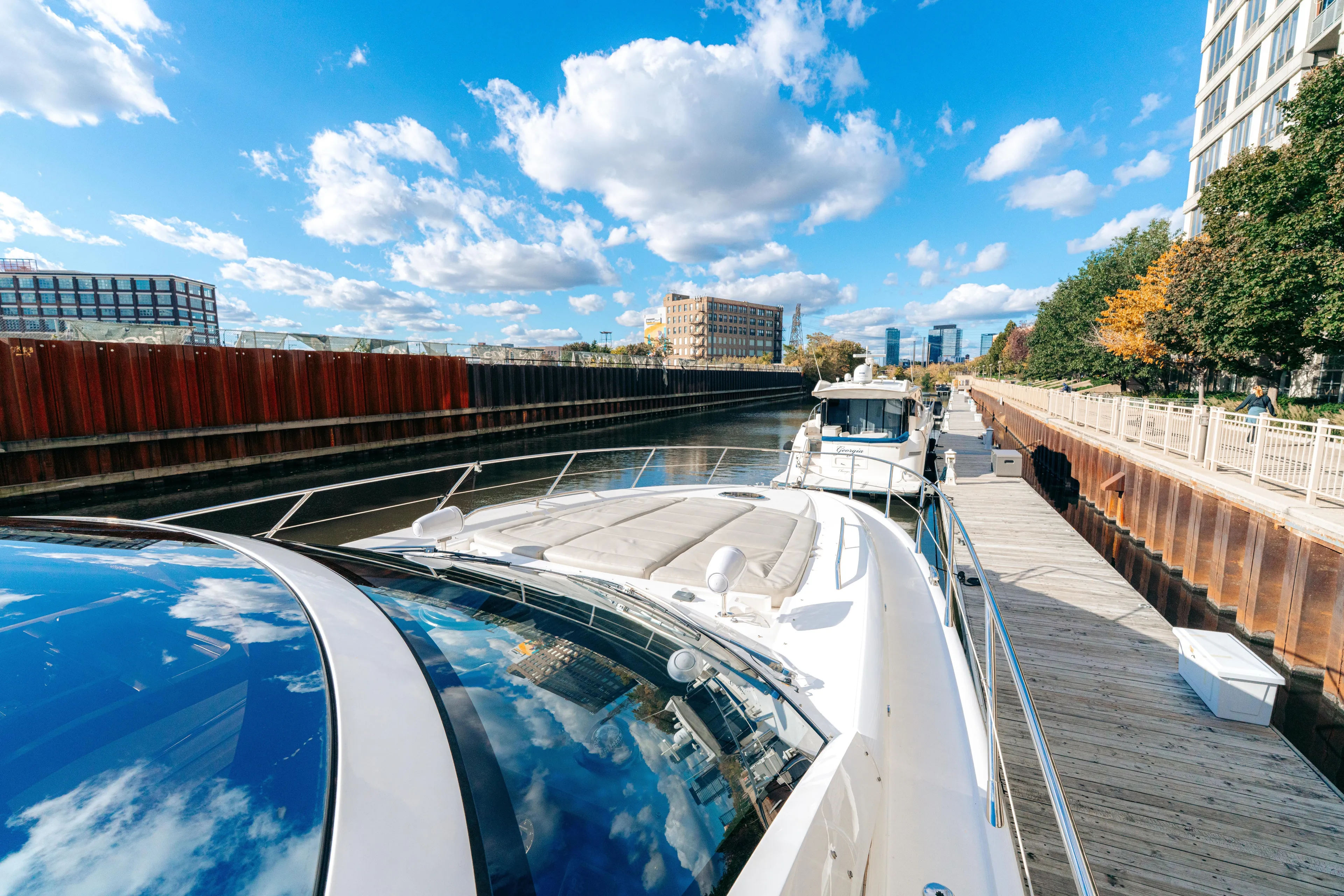  Yacht Photos Pics 2014 Sunseeker Predator 60 yacht docked in a sunny urban marina.