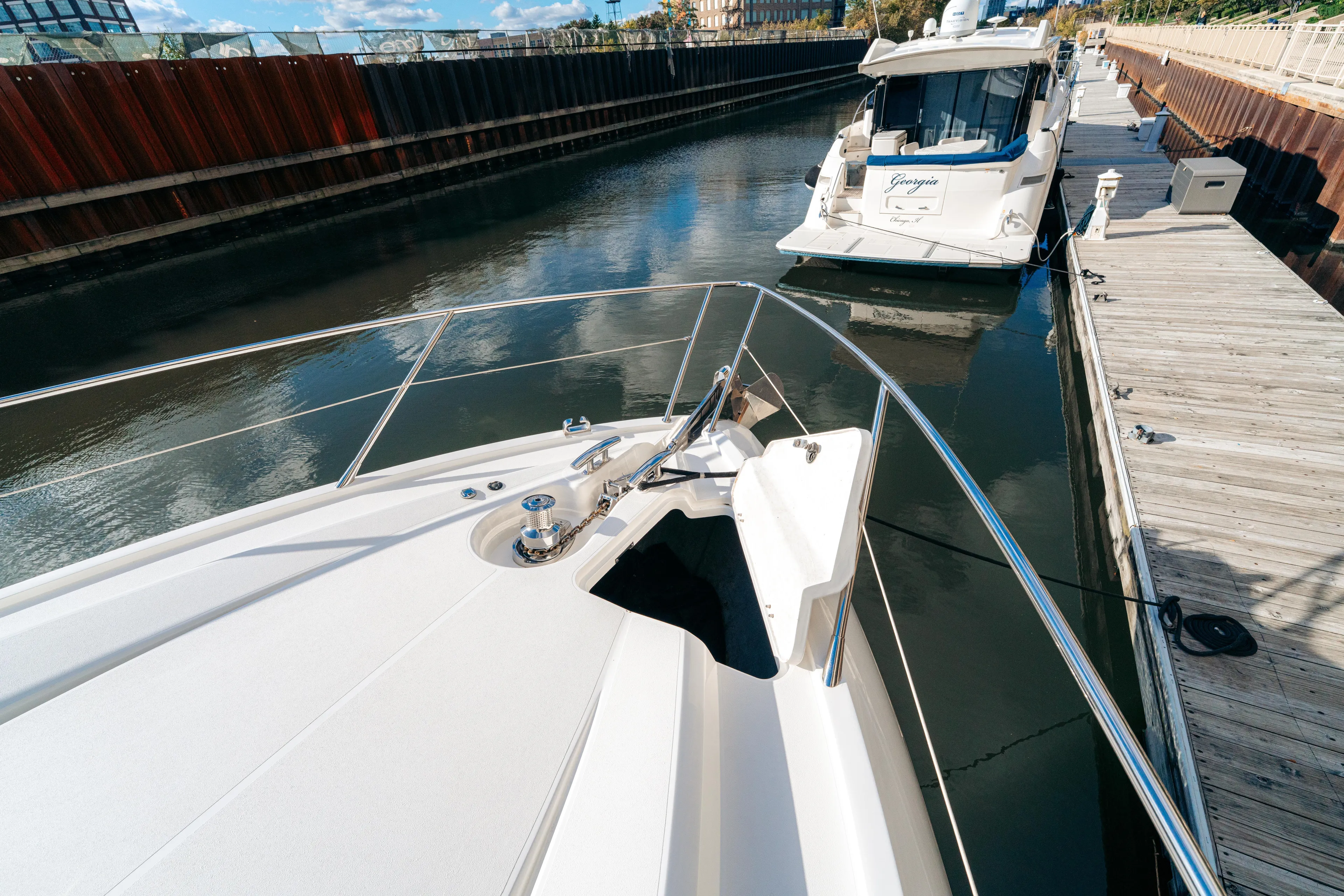  Yacht Photos Pics Bow view of 2014 Sunseeker Predator 60 yacht docked in a marina.