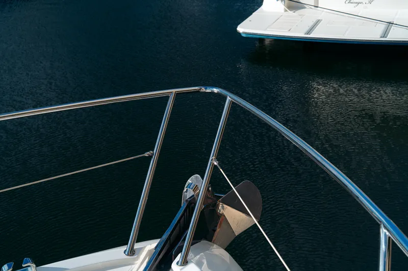  Yacht Photos Pics Bow view of 2014 Sunseeker Predator 60 yacht on calm water.