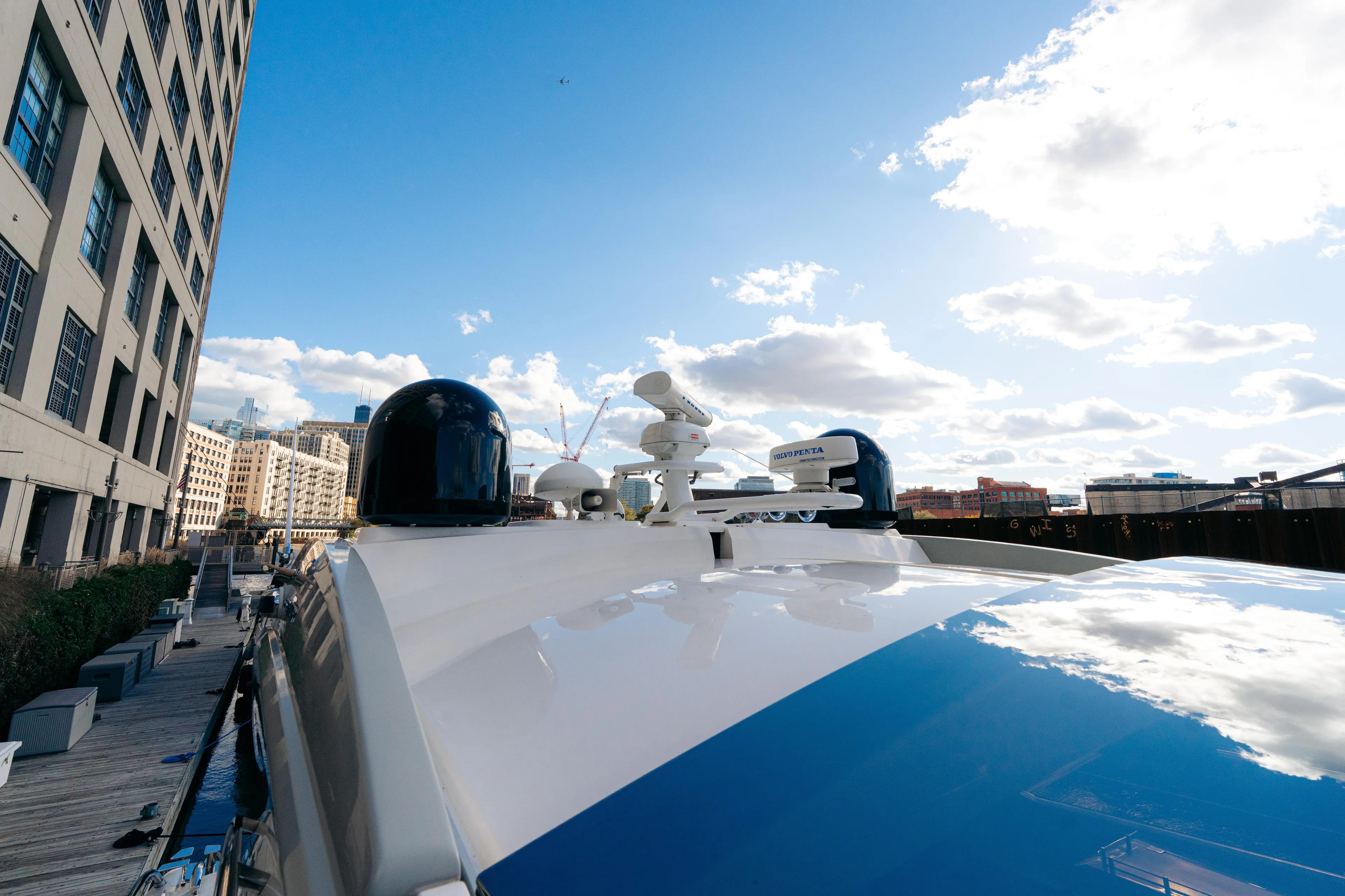  Yacht Photos Pics Sunseeker Predator 60 yacht, 2014 model, docked under a bright blue sky.