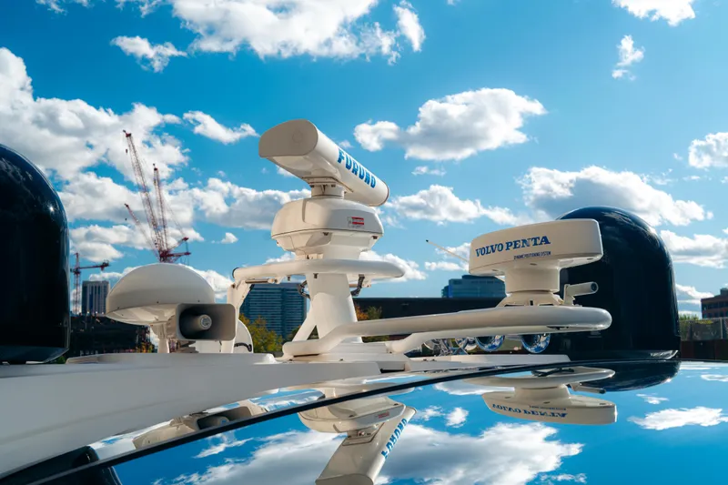  Yacht Photos Pics Rooftop equipment on 2014 Sunseeker Predator 60 yacht under blue sky.