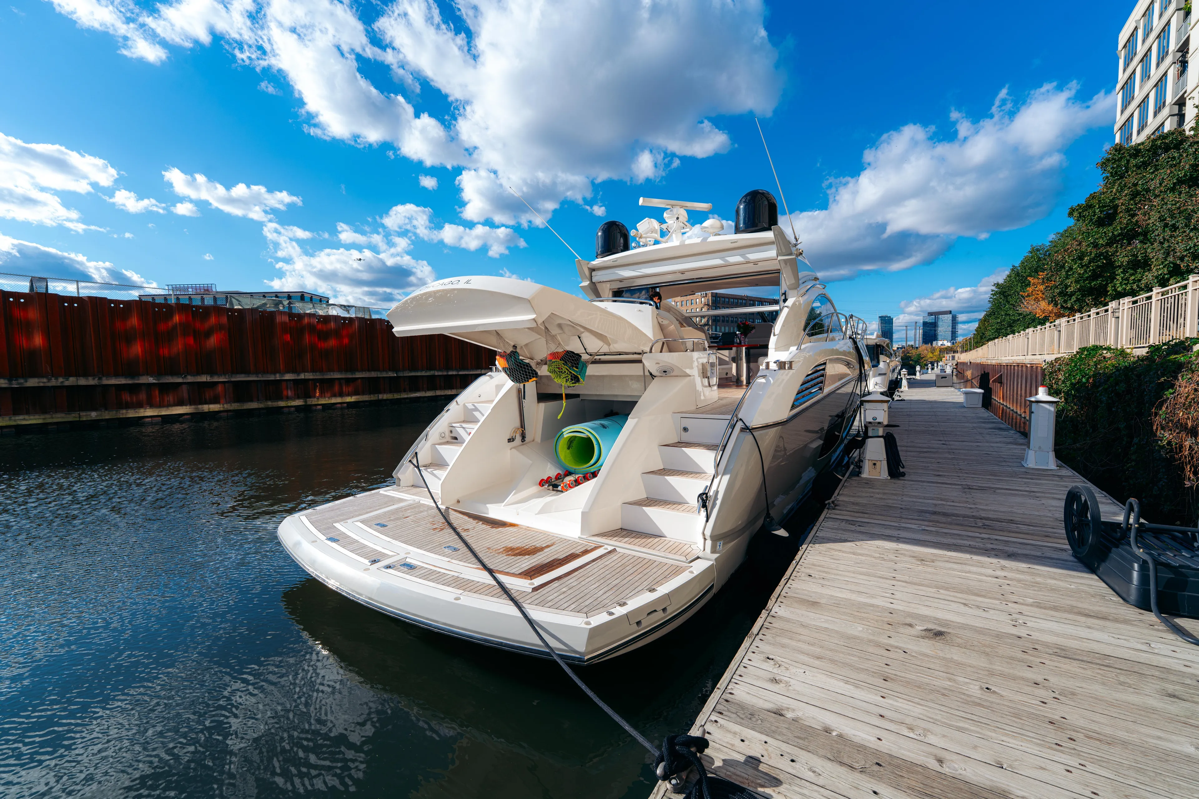  Yacht Photos Pics Luxurious 2014 Sunseeker Predator 60 yacht docked under a vibrant blue sky.