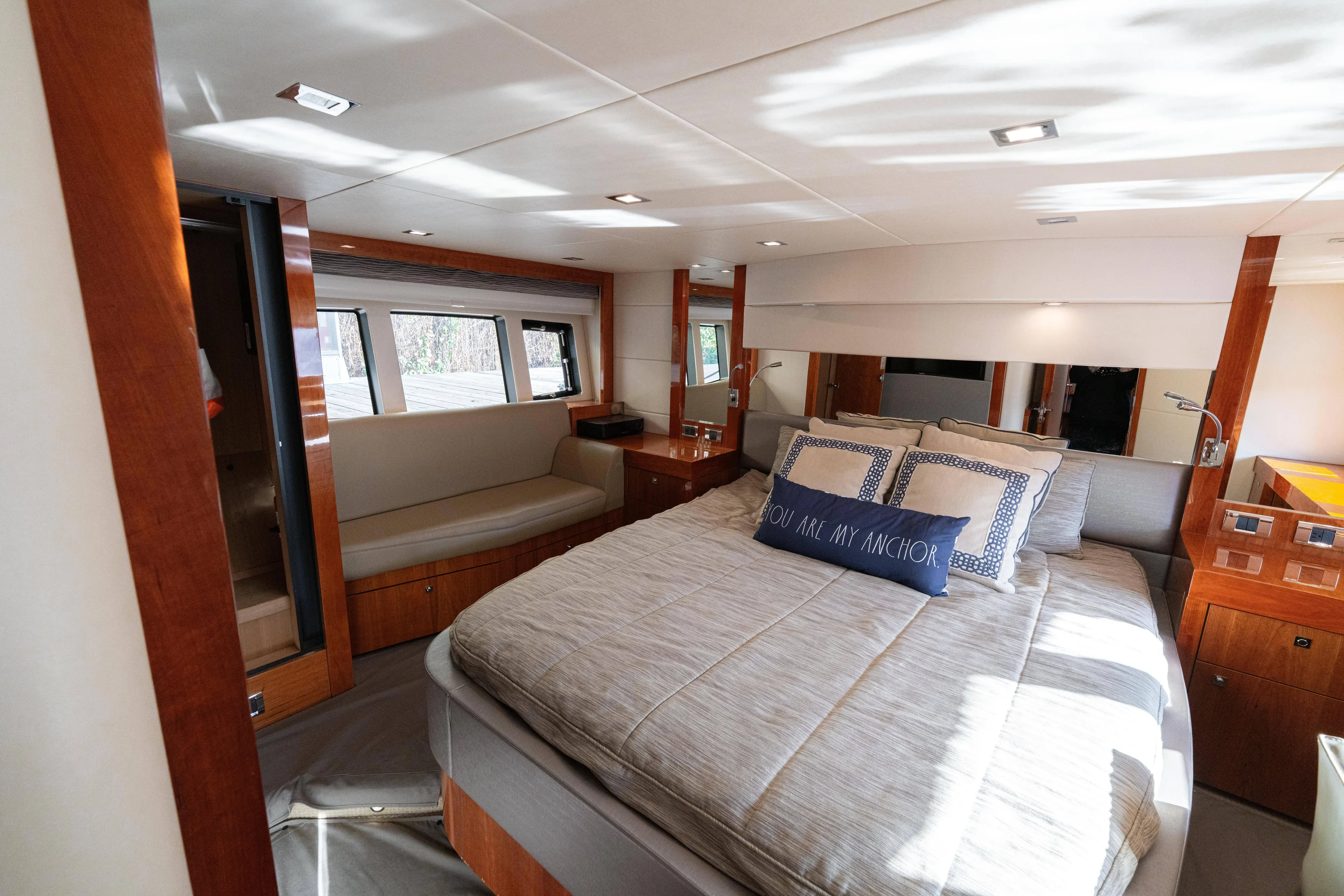  Yacht Photos Pics Luxurious bedroom interior of 2014 Sunseeker Predator 60 yacht with elegant wood finishes.
