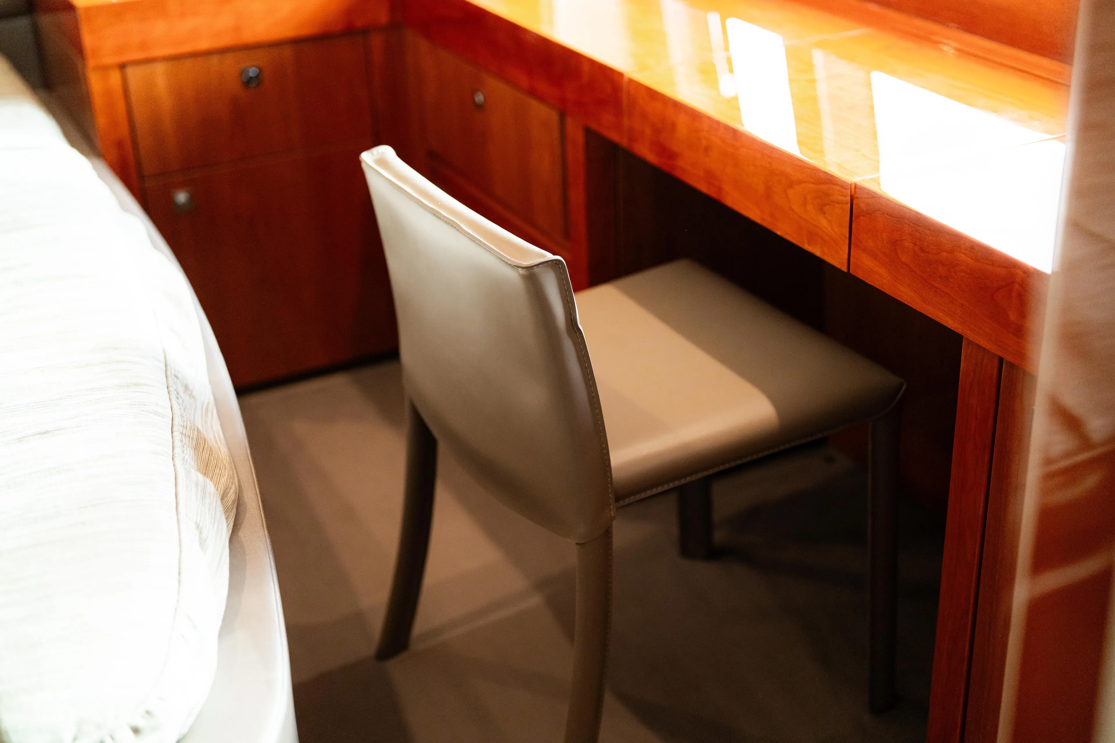  Yacht Photos Pics Luxurious interior of 2014 Sunseeker Predator 60 yacht with elegant chair and wooden desk.