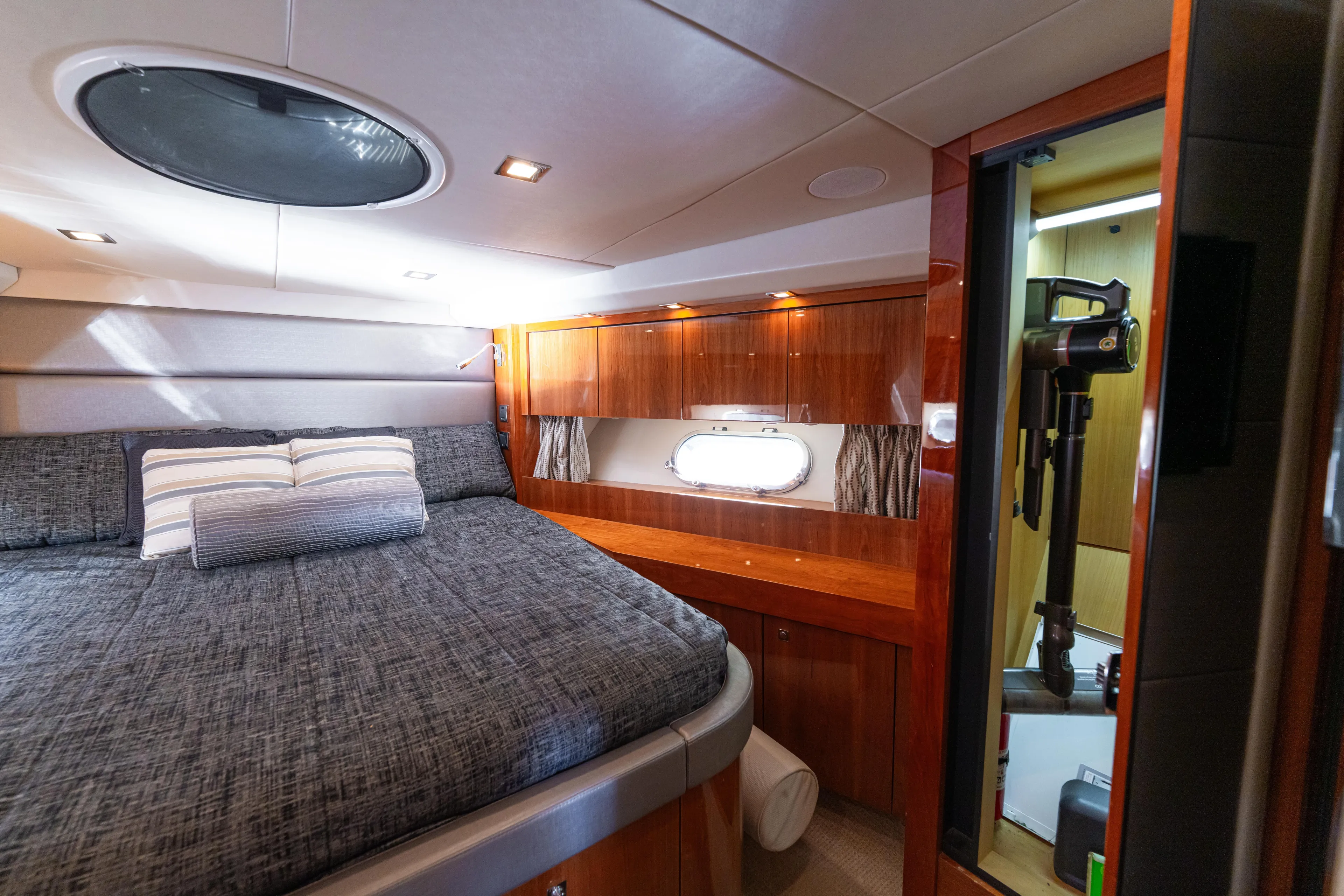 Yacht Photos Pics Luxurious cabin interior of 2014 Sunseeker Predator 60 yacht with elegant wood finishes.