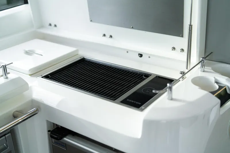  Yacht Photos Pics Outdoor grill on 2014 Sunseeker Predator 60 yacht, featuring sleek design and modern amenities.