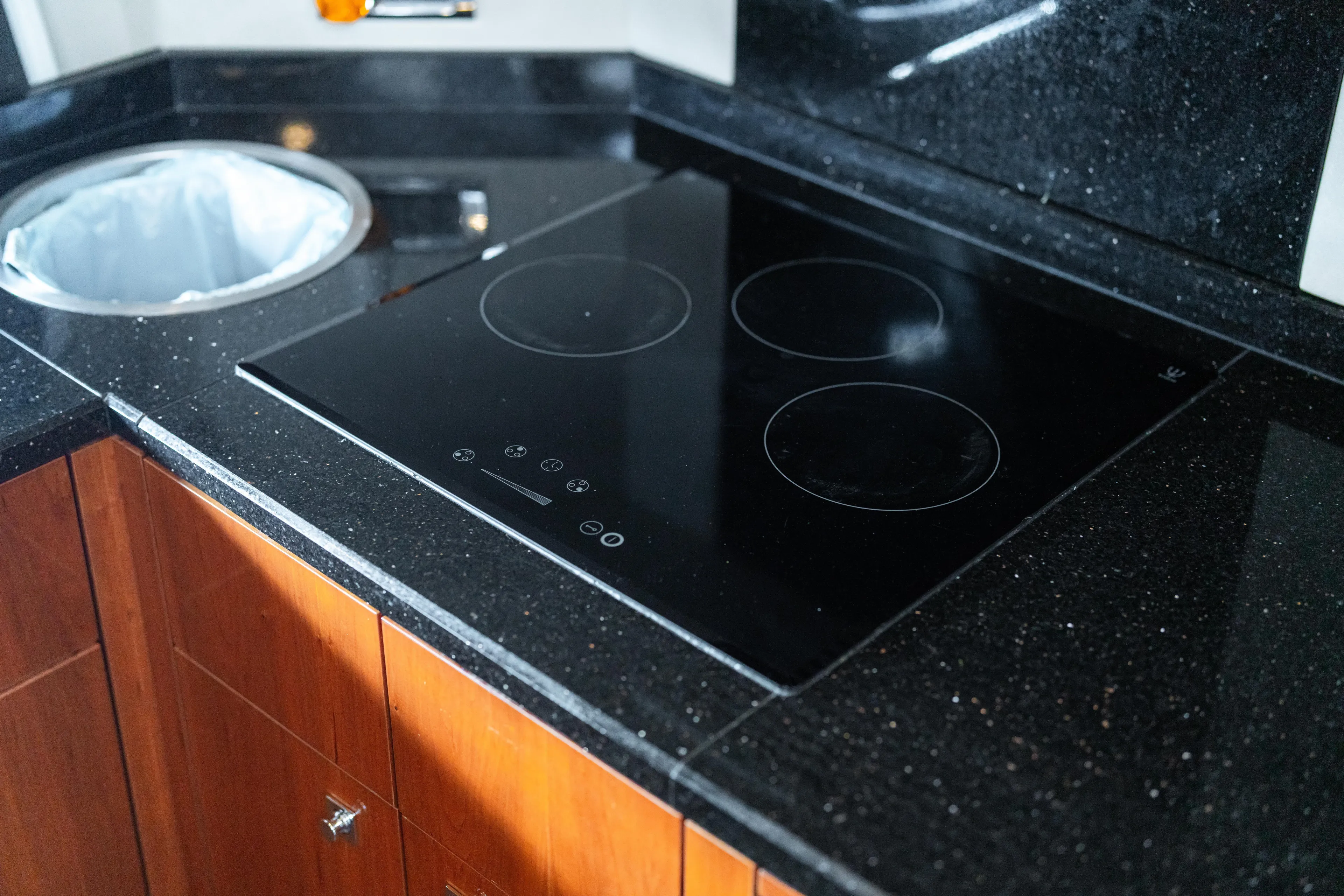  Yacht Photos Pics Modern kitchen in 2014 Sunseeker Predator 60 yacht with sleek black cooktop.