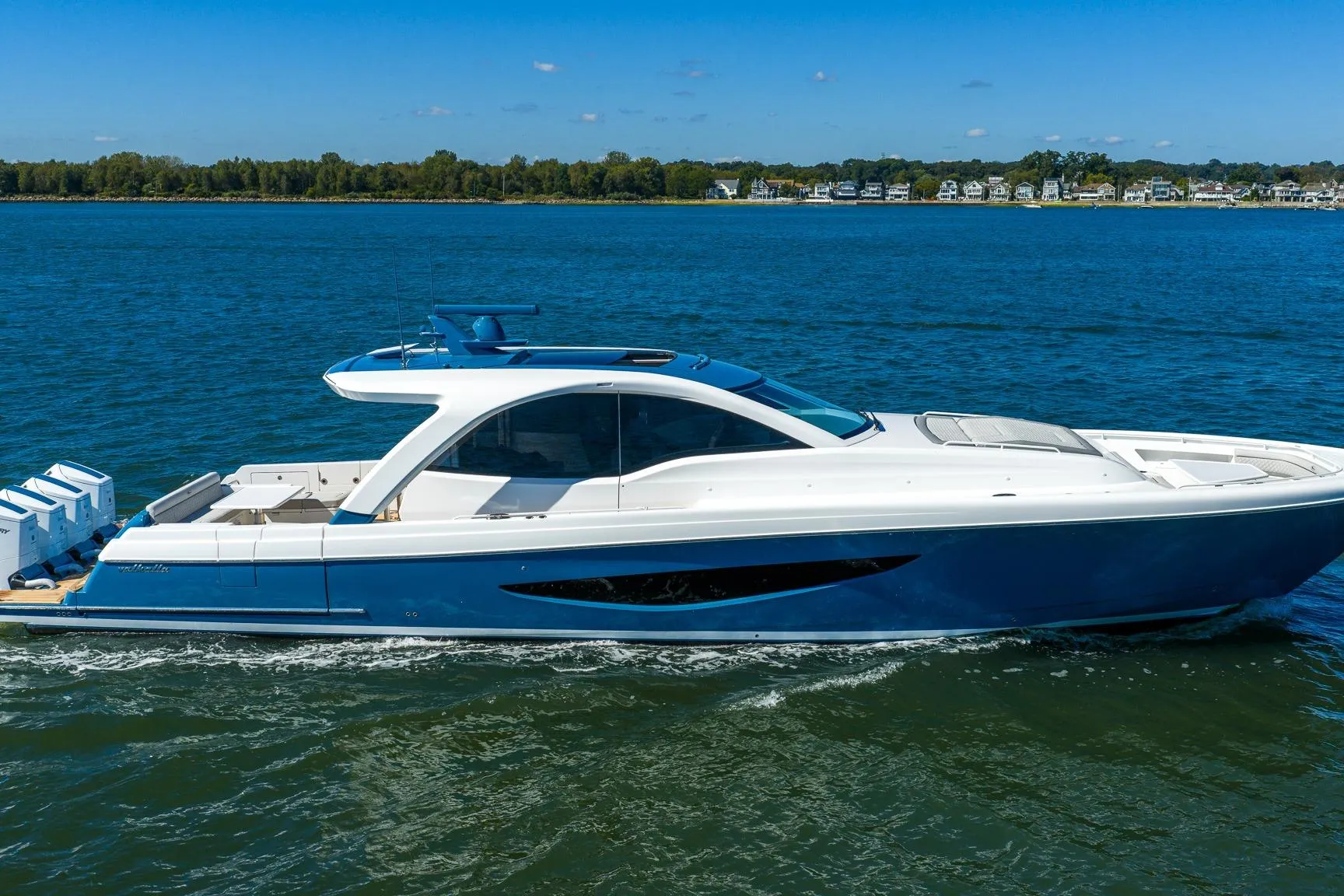 2026 Valhalla V-55 Sport Yacht cruising on a sunny day, showcasing sleek design.